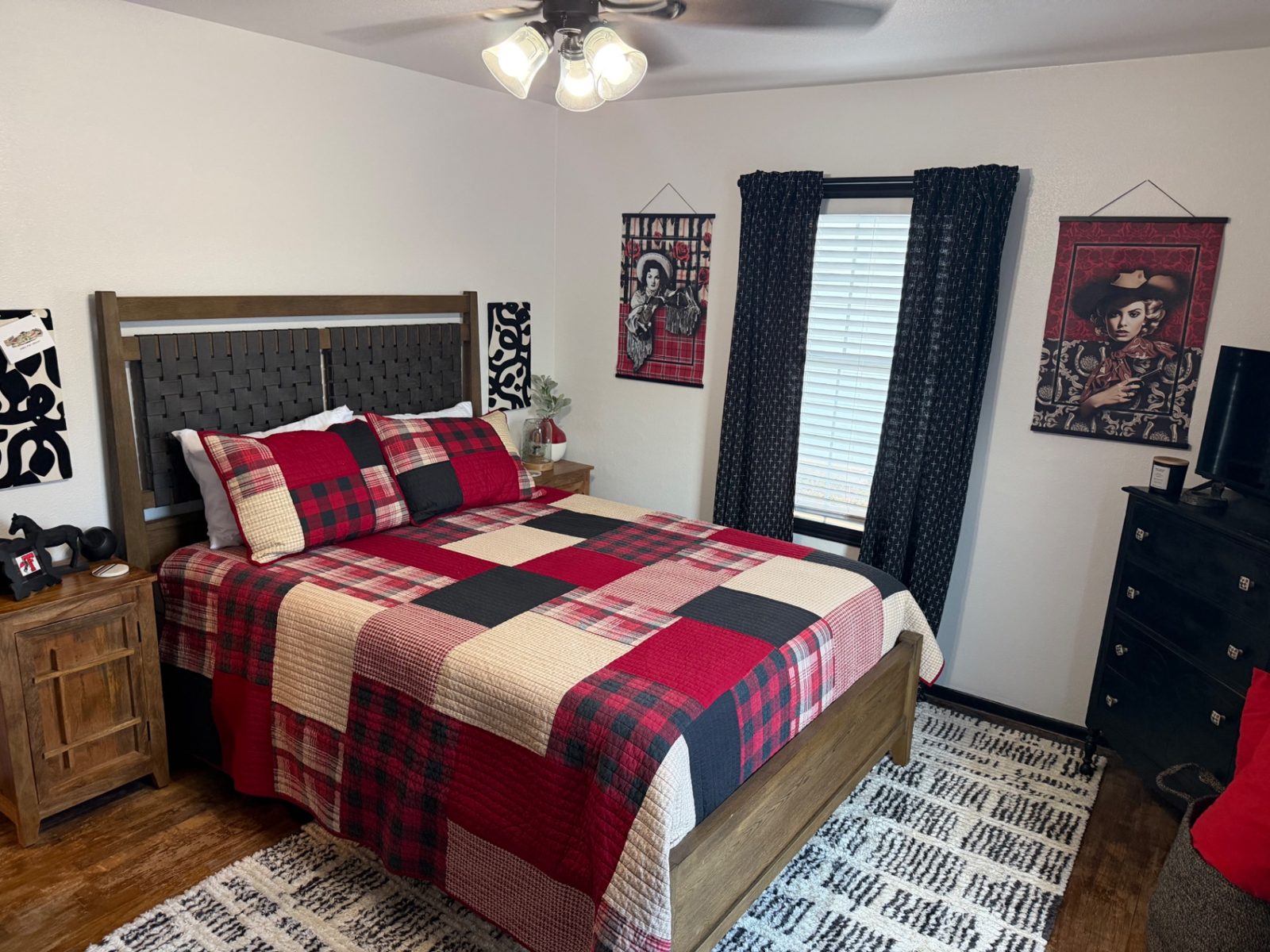 Front of the teal 28th Street house with a walkway to the porch — Queen bedroom