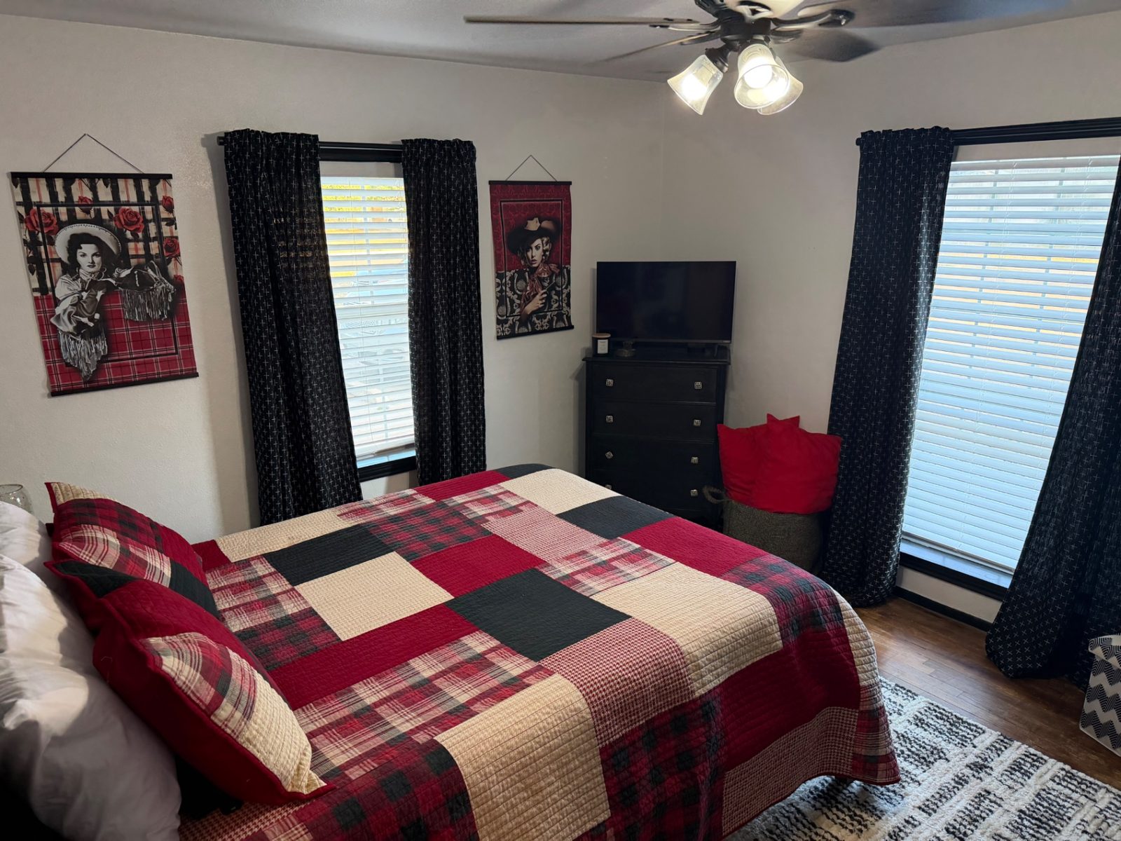 Front of the teal 28th Street house with a walkway to the porch — Queen bedroom