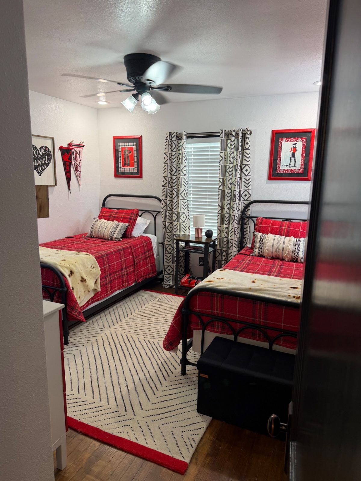 Front of the teal 28th Street house with a walkway to the porch — Twin bedroom