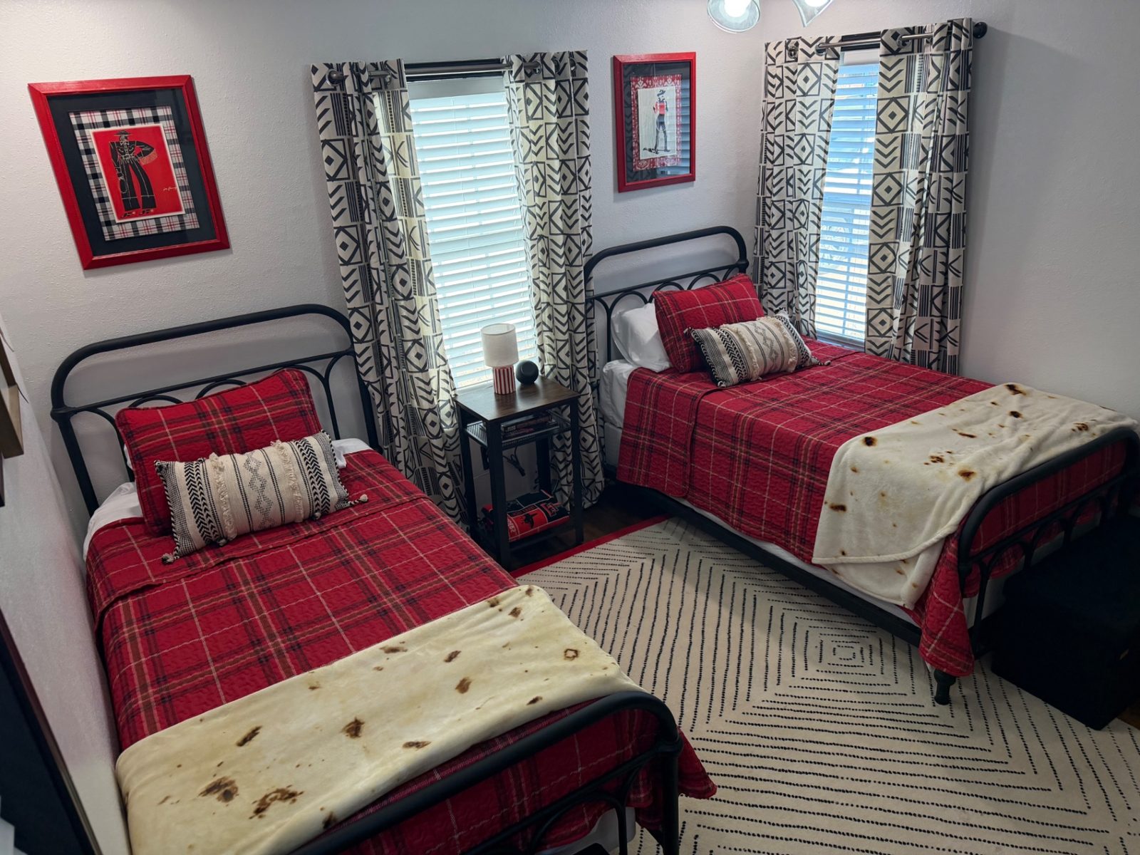 Front of the teal 28th Street house with a walkway to the porch — Twin bedroom