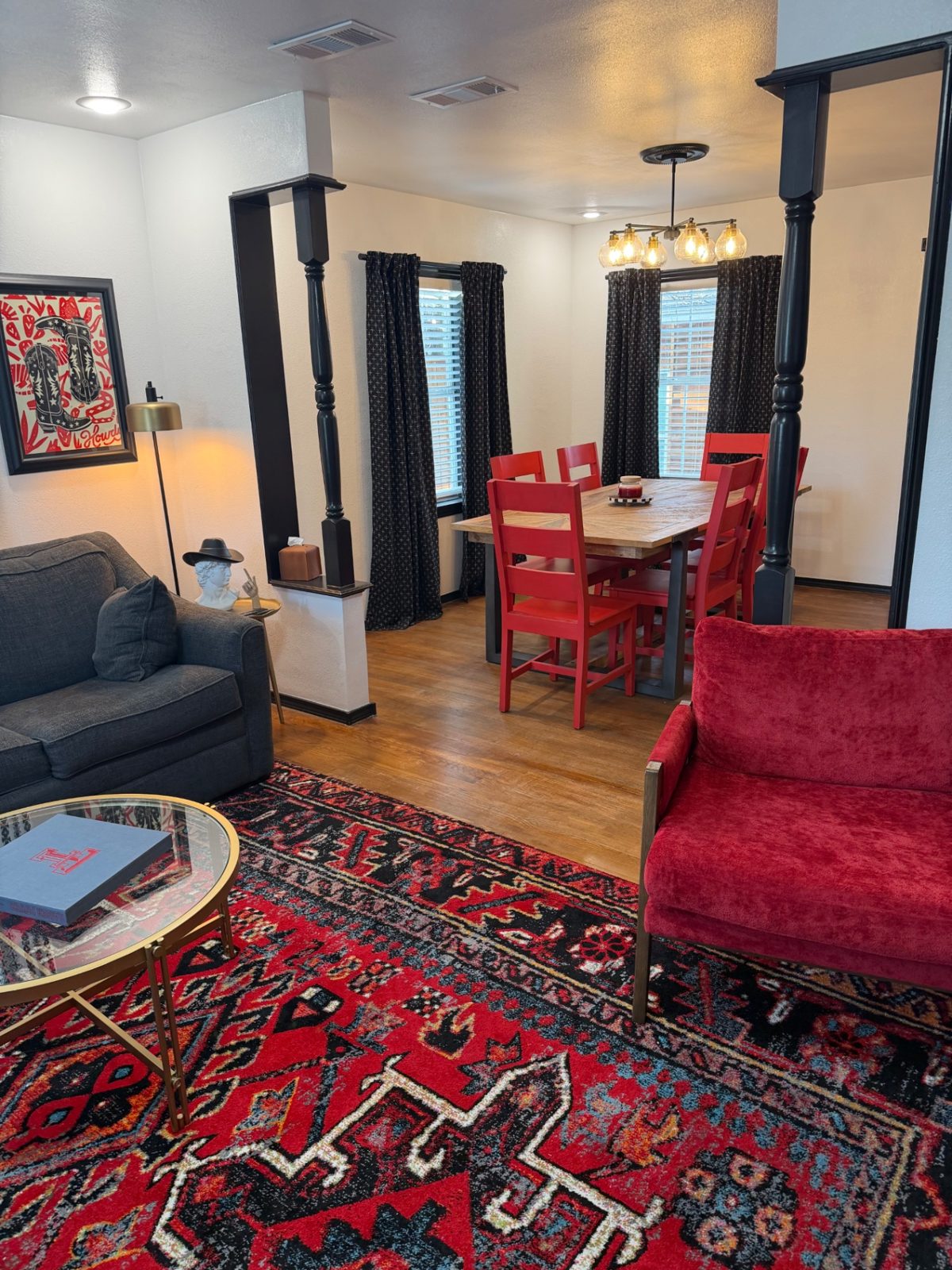 Front of the teal 28th Street house with a walkway to the porch — Living & dining